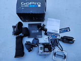GoPro Hero 3 action camera with housing, mounts, straps, and protective case accessories