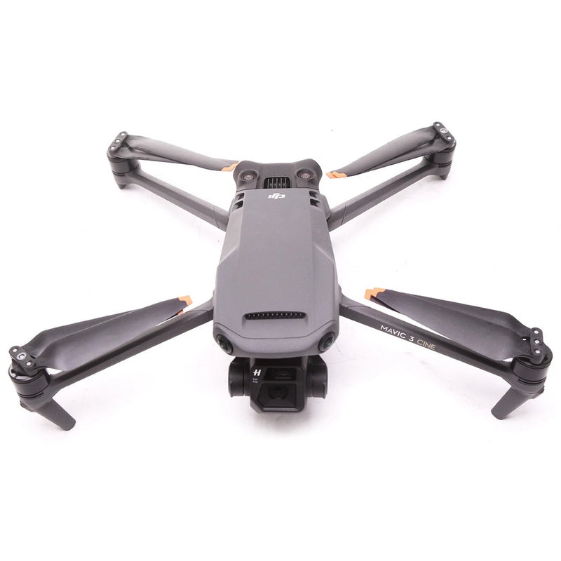 Gray DJI Mavic drone with four propeller arms extended and front camera gimbal