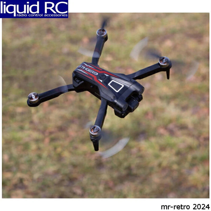 Quadcopter FPV drone with dark body, red accents, and front camera module