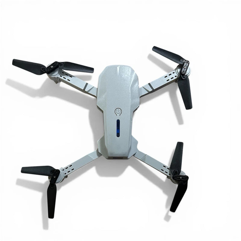 Mini drone with HD 4K camera, white body and four black propeller arms