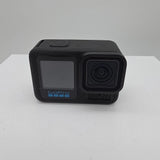 GoPro action camera with front lens and dark LCD screen, black body