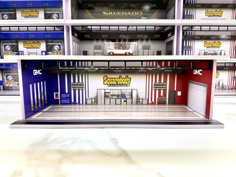 1:64 scale LED model garage diorama with blue and red roll-up doors