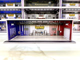 1:64 scale LED model garage diorama with blue and red roll-up doors
