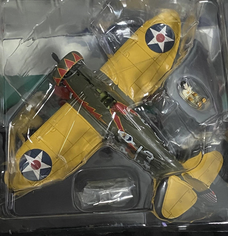 Yellow P-26A Peashooter model plane with red-white roundel markings, in clear blister pack