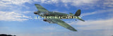 Green RC balsa ply airplane model with laser-cut wings and fuselage, flying