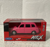 Welly Nex Die Cast Model Of The London Taxi TX4 In Pink. New In Box.