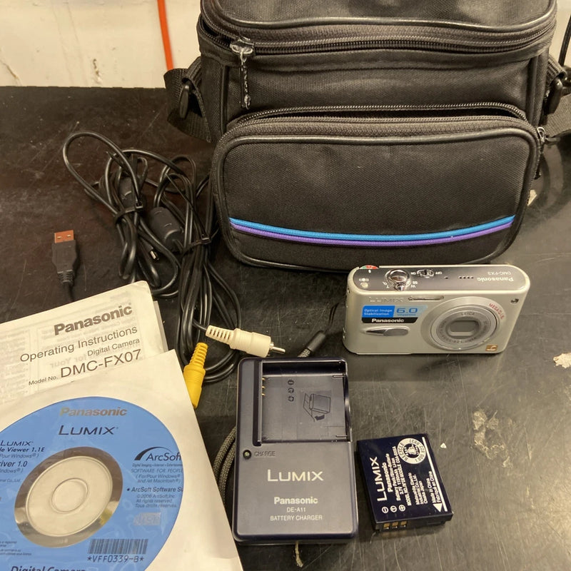 Compact Lumix digital camera with battery, charger, manual, CD, in zip carrying case