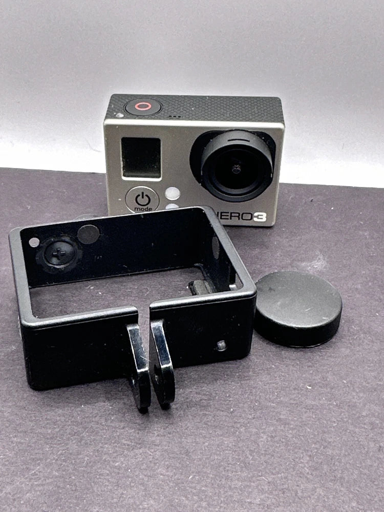 GoPro action camera with lens and open mount, silver housing with black accessories