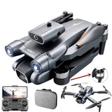 Compact grey quadcopter drone with built-in camera, plus remote and carrying case.