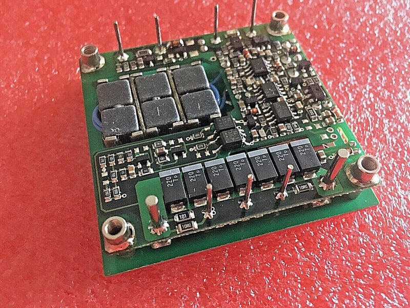 DC to DC converter PCB module with capacitors and switching ICs, green circuit board