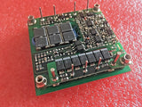 DC to DC converter PCB module with capacitors and switching ICs, green circuit board