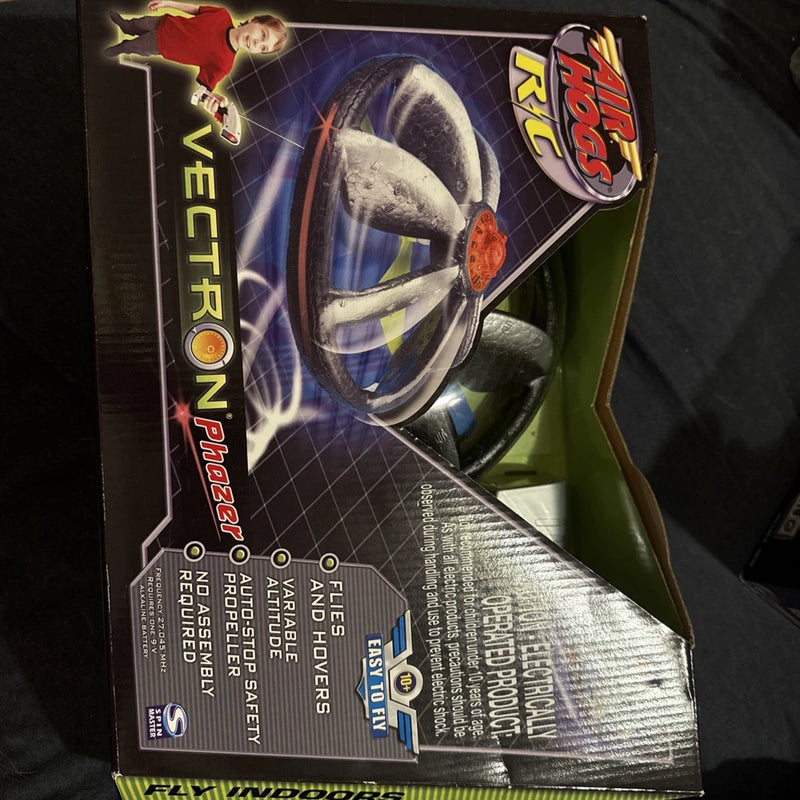 Indoor mini flying UFO drone in retail box, green and black packaging