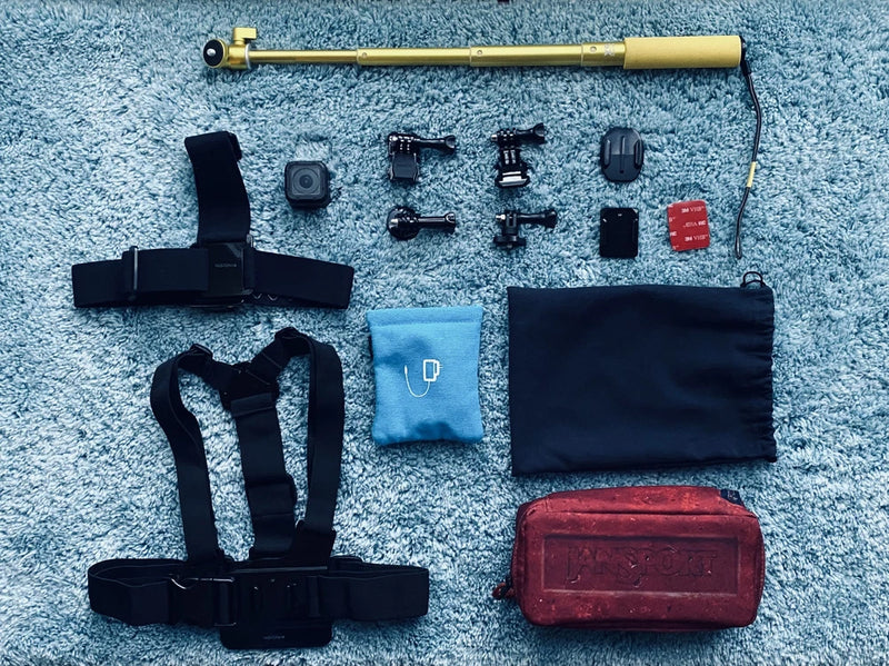 GoPro HERO4 Session action camera accessory kit with mounts, straps, and carrying case