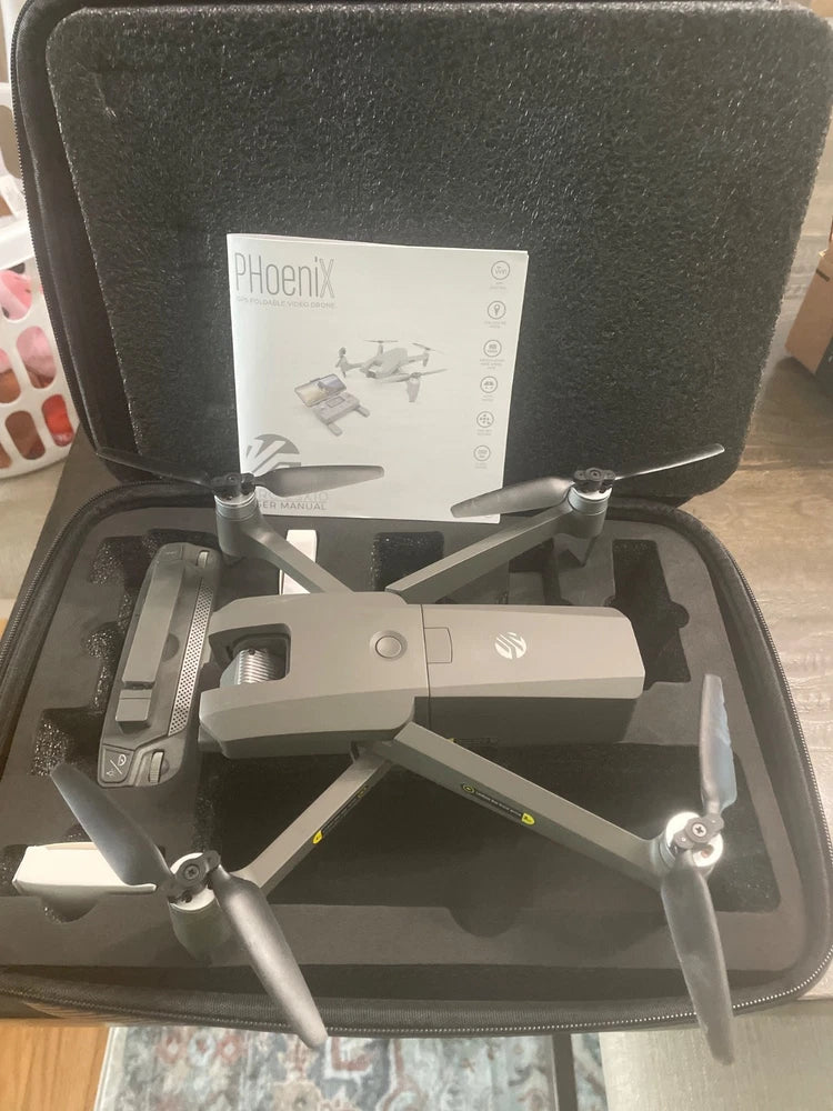 Used PHoeniX DRC-LSX10 drone in carrying case with folded propellers