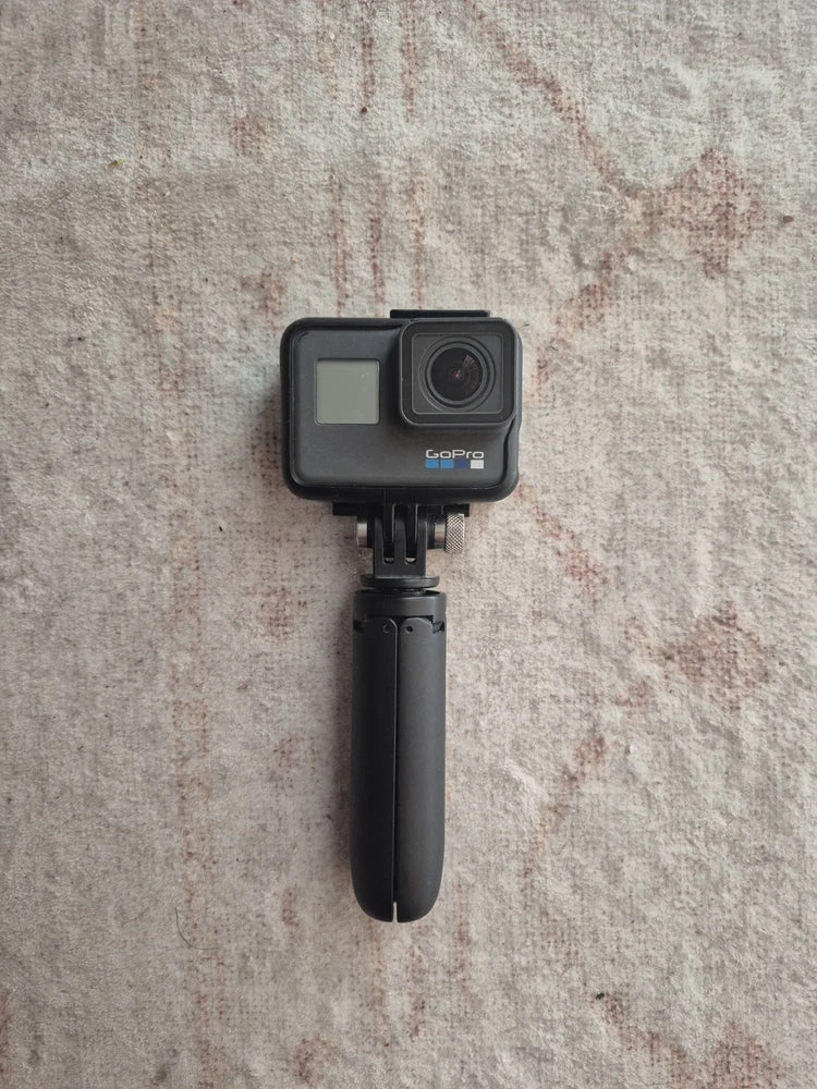 GoPro HERO5 action camera with touchscreen, front lens, and black handheld handle