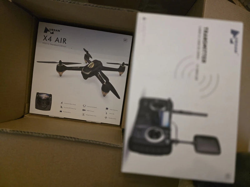 Drone and remote transmitter in retail boxes