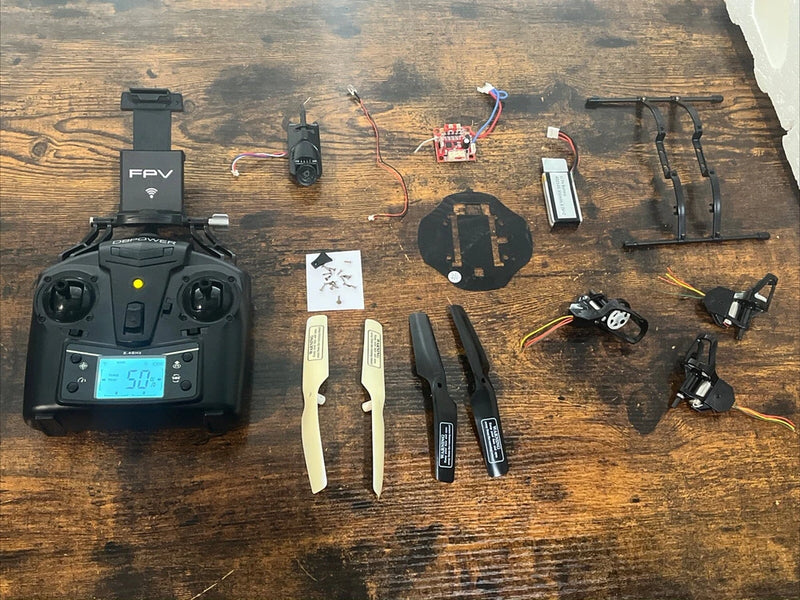 FPV drone controller and spare parts kit with batteries, antennas, propellers