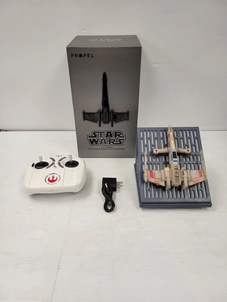 Star Wars T-65 X-Wing drone with white remote controller and accessories, in box