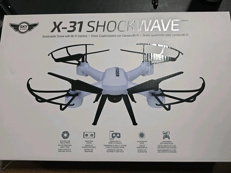 White quadcopter drone with Wi‑Fi camera, shown on product box packaging