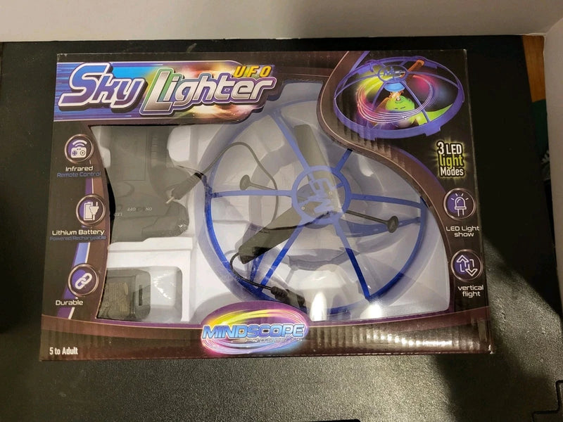 Blue micro UFO mini drone with LED lights, infrared remote control, in retail box