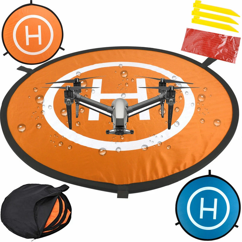 Orange waterproof foldable drone landing pad with white H markings and carrying bag