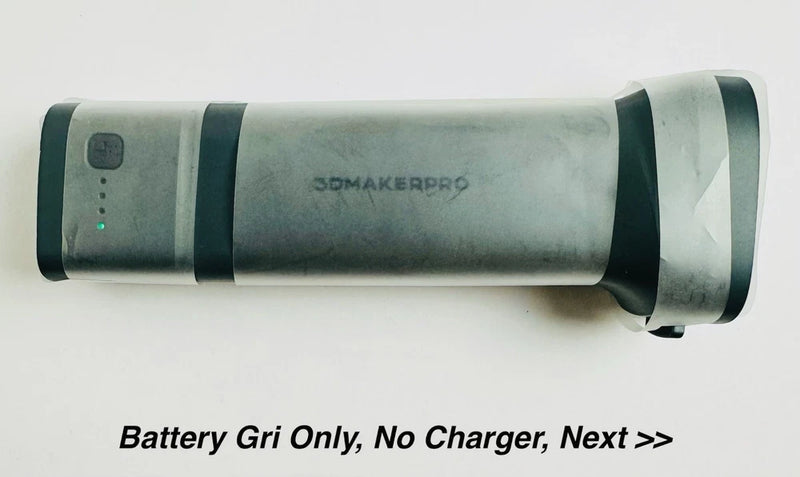 Cylindrical battery grip for 3D scanner, gray body with dark end caps, open box