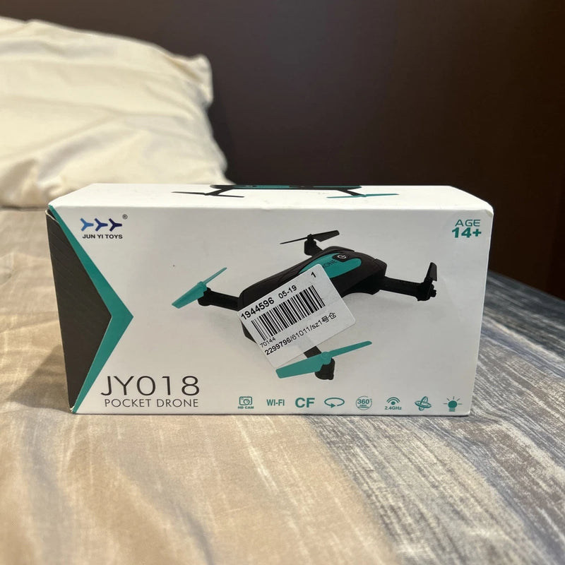 Pocket drone toy in retail box, foldable design, Wi‑Fi