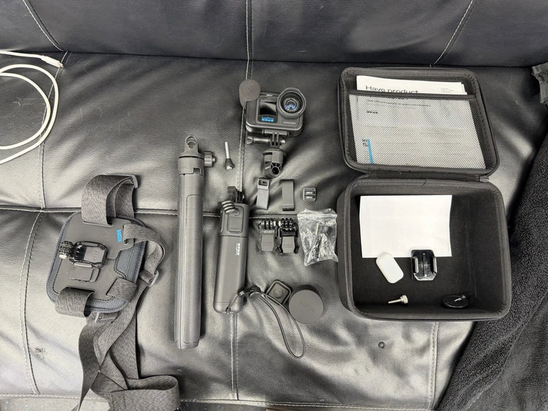GoPro HERO13 Black action camera kit with mounts, case, and accessories, waterproof design