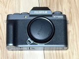 FUJIFILM X-T200 camera body in dark silver with black lens cap