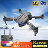 Foldable grey quadcopter RC drone with front camera and blue LEDs