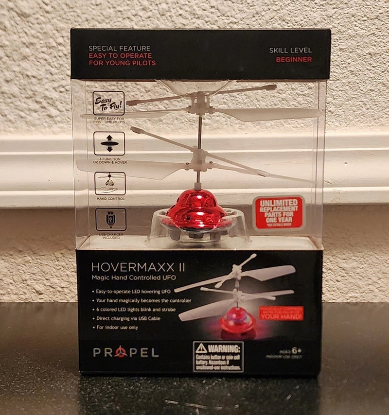 Hovermaxx II Magic hand-controlled UFO propeller drone toy in red retail box