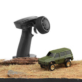 Green 1:64 4WD RC car with black handheld controller