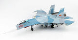 Light blue camo fighter jet model with landing gear, side view