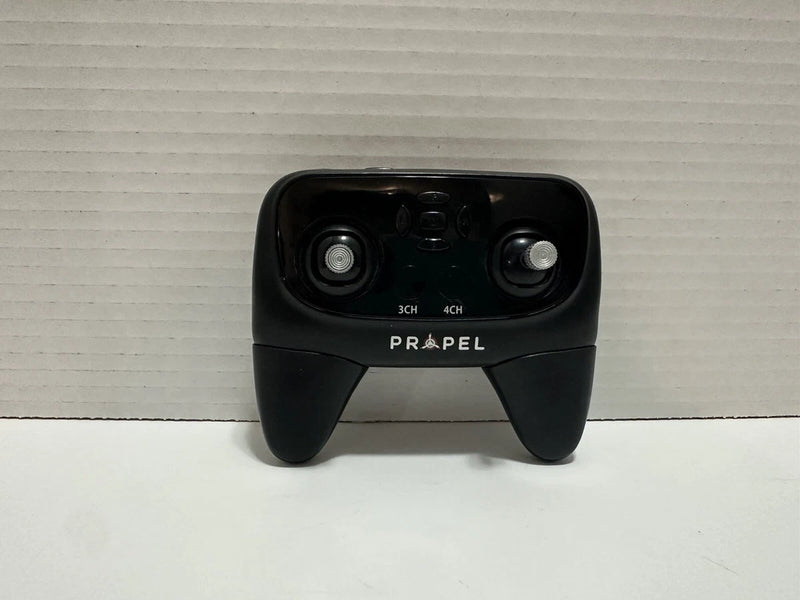 Black drone remote controller with two joysticks and Propel logo.