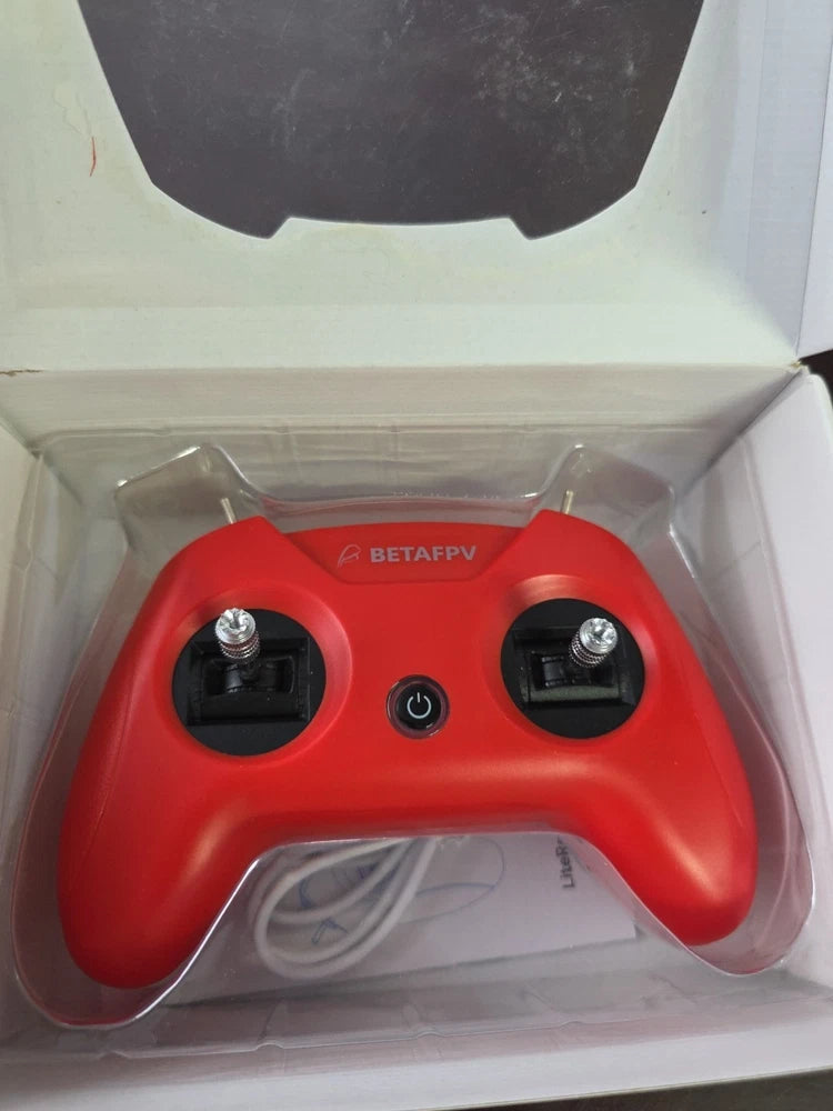 BETAFPV LiteRadio 2 SIM controller in crimson red with dual joysticks and power button