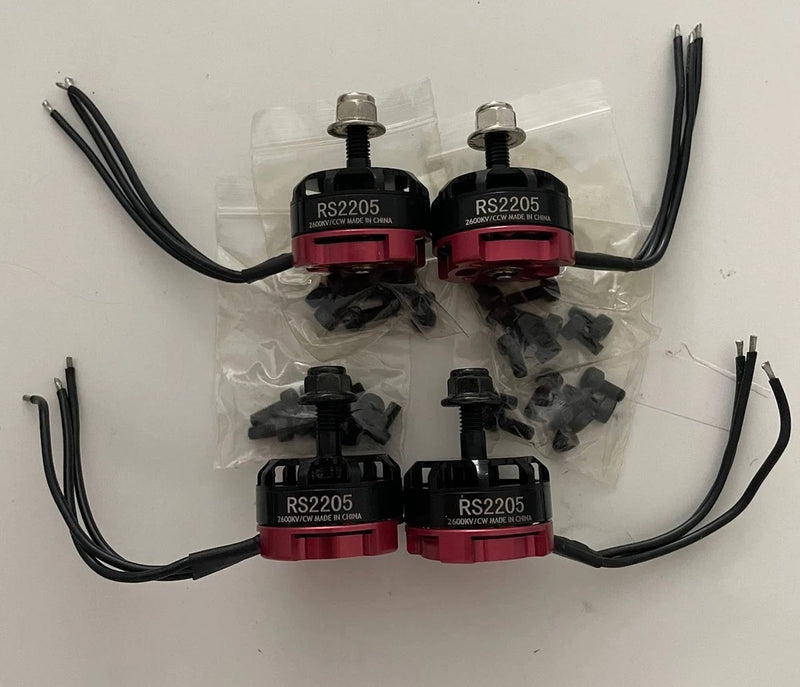 RS2205 brushless RC drone motor set with 4 motors, red hubs, and attached leads