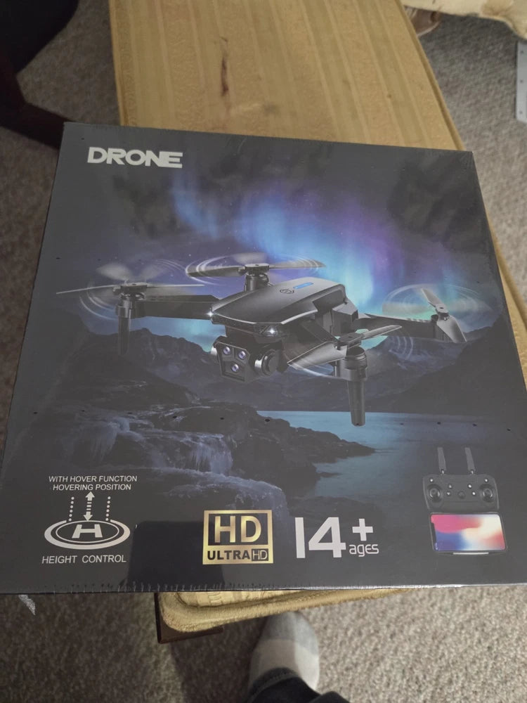 Smart folding drone retail box showing quadcopter, HD 14+ and control remote