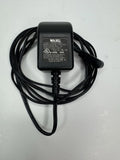 Wahl battery charger with black power cord and two-prong mount plug