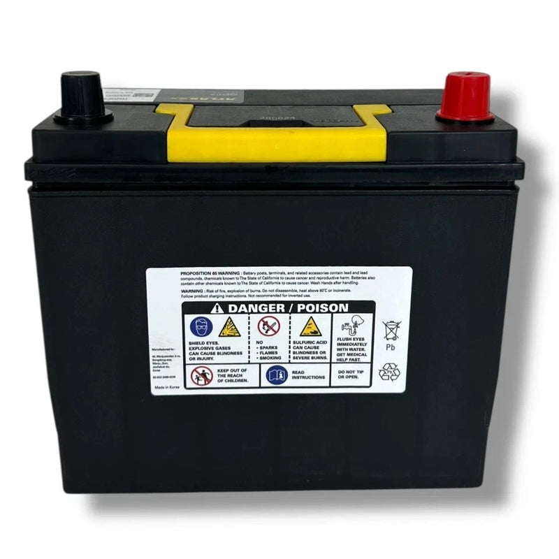 Black 12V car battery with red and black terminals and yellow top label