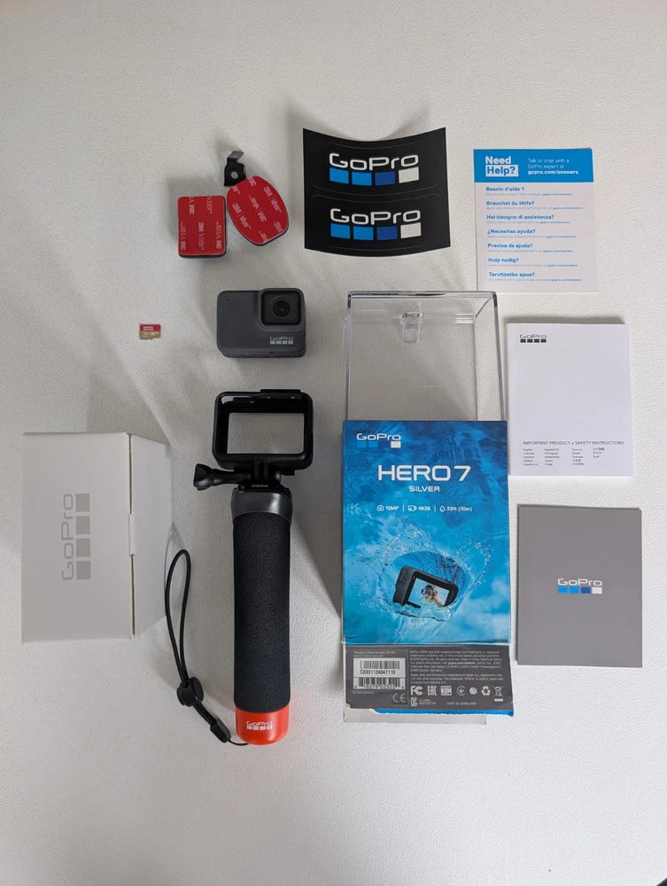 Silver GoPro HERO7 action camera with black housing and included accessories