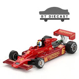 Red 1/64 scale race car model with driver figure and front wing details