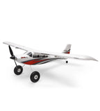 White and red electric RC airplane with nose prop and tricycle landing gear