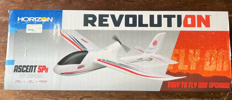 RC glider foam airplane box art, white with red and gray accents