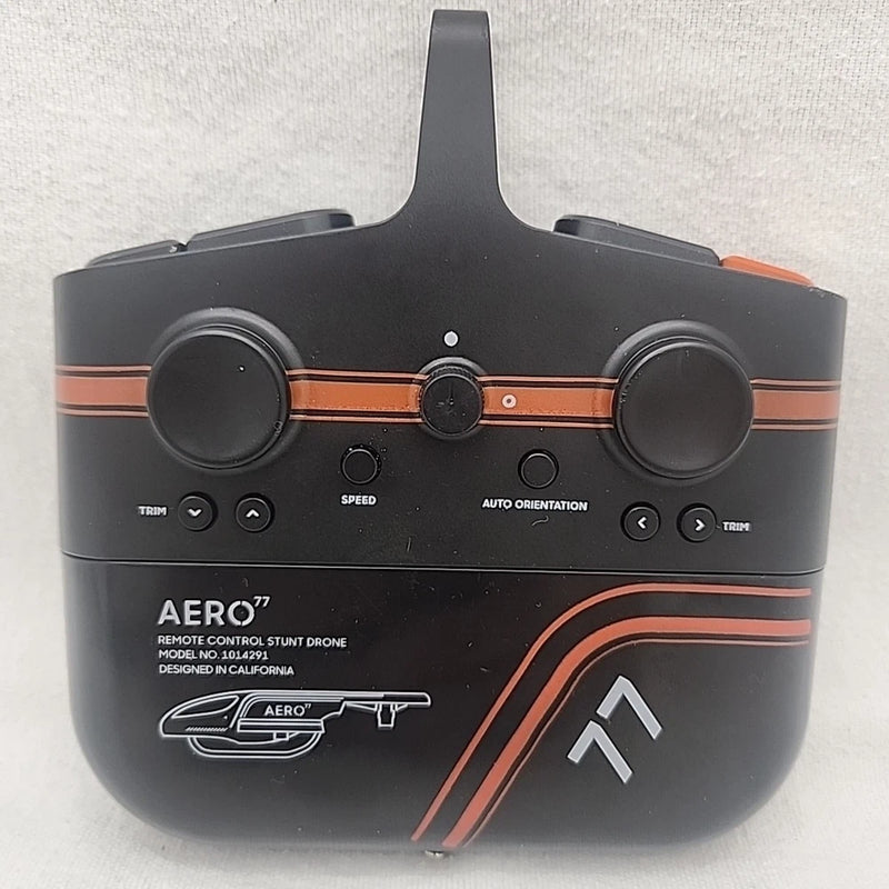 Black RC stunt drone controller with orange trim, dual thumbsticks and button panel