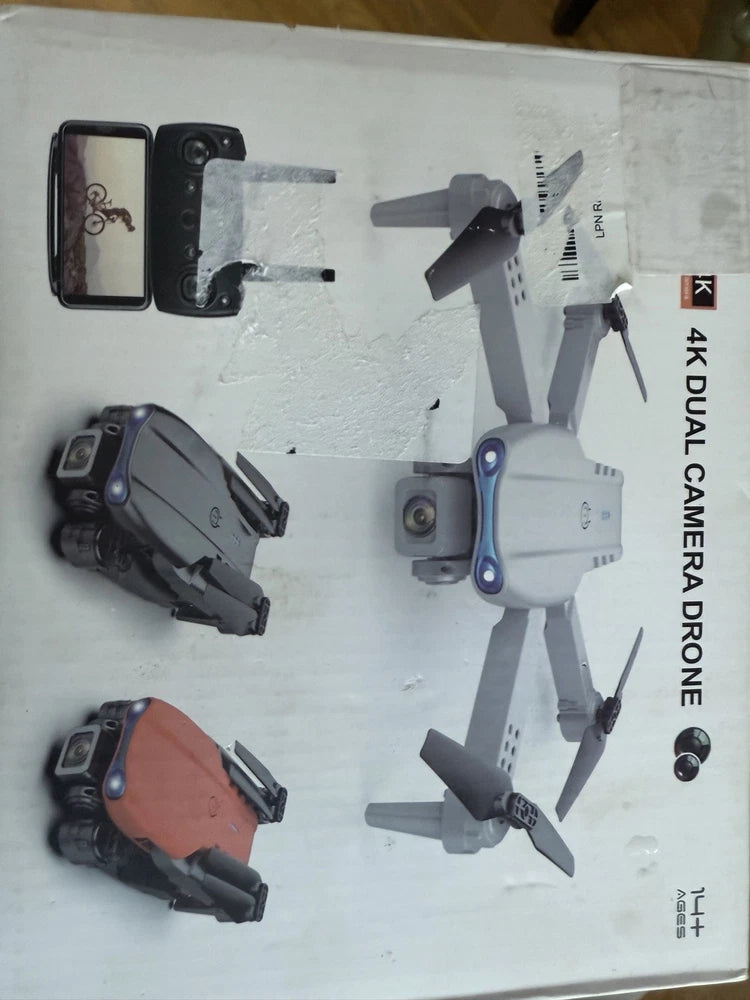 White RC quadcopter drone with 4 propellers and 4K camera, shown in open box