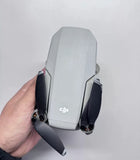 DJI Mini 1 drone with two front propellers, compact gray body
