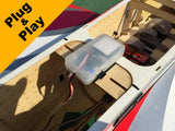Model airplane plug-and-play data logger in a clear plastic enclosure with wires