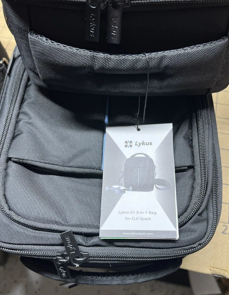 Gray zippered drone carry bag with interior mesh pocket and Lykus product tag