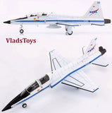 White and blue Northrop T-38C Talon die-cast model airplane with landing gear and stand