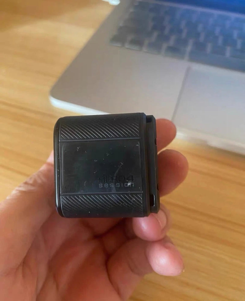 GoPro Session action camera, black square housing with lens window and mount